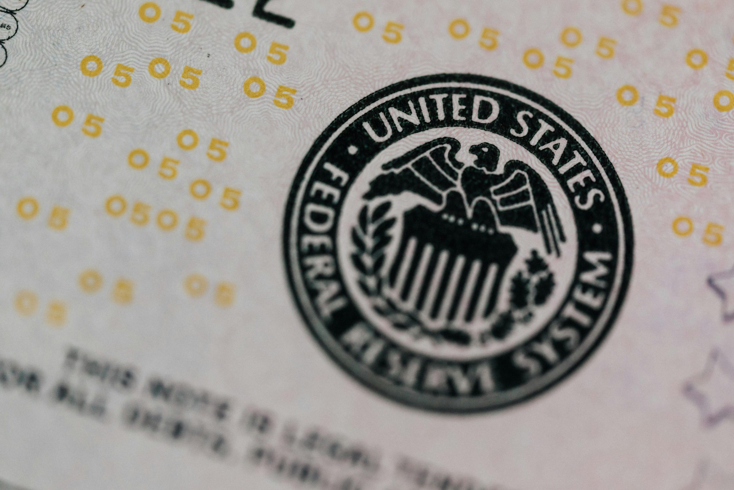 Image of an envelope with the United States Federal Reserve logo slightly blurred on the bottom.